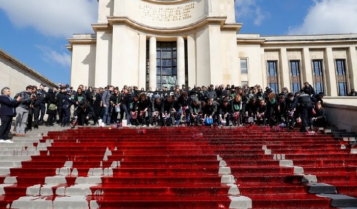 Fake blood flows at anti-extinction protest in Paris